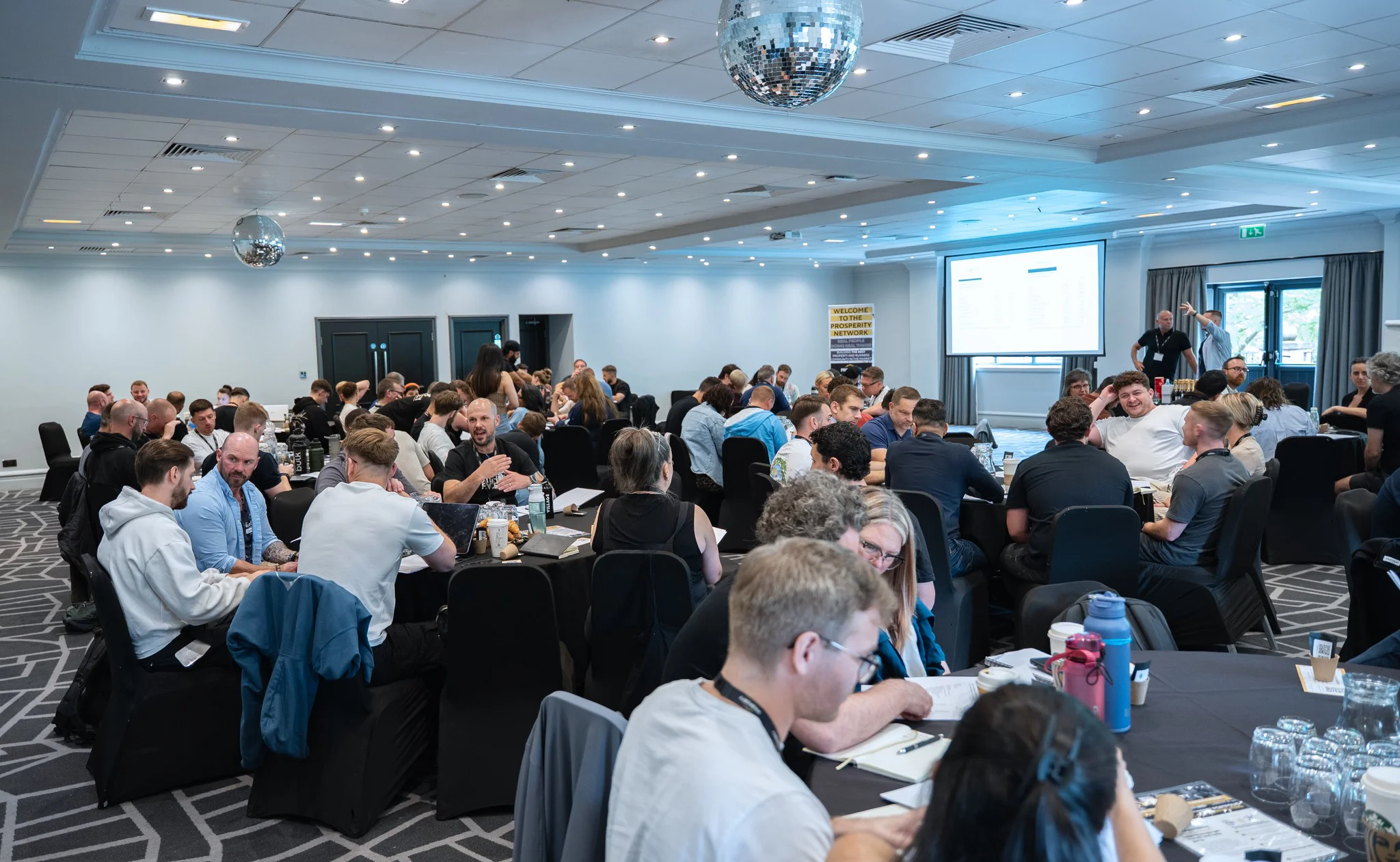 Photo of a room of people talking